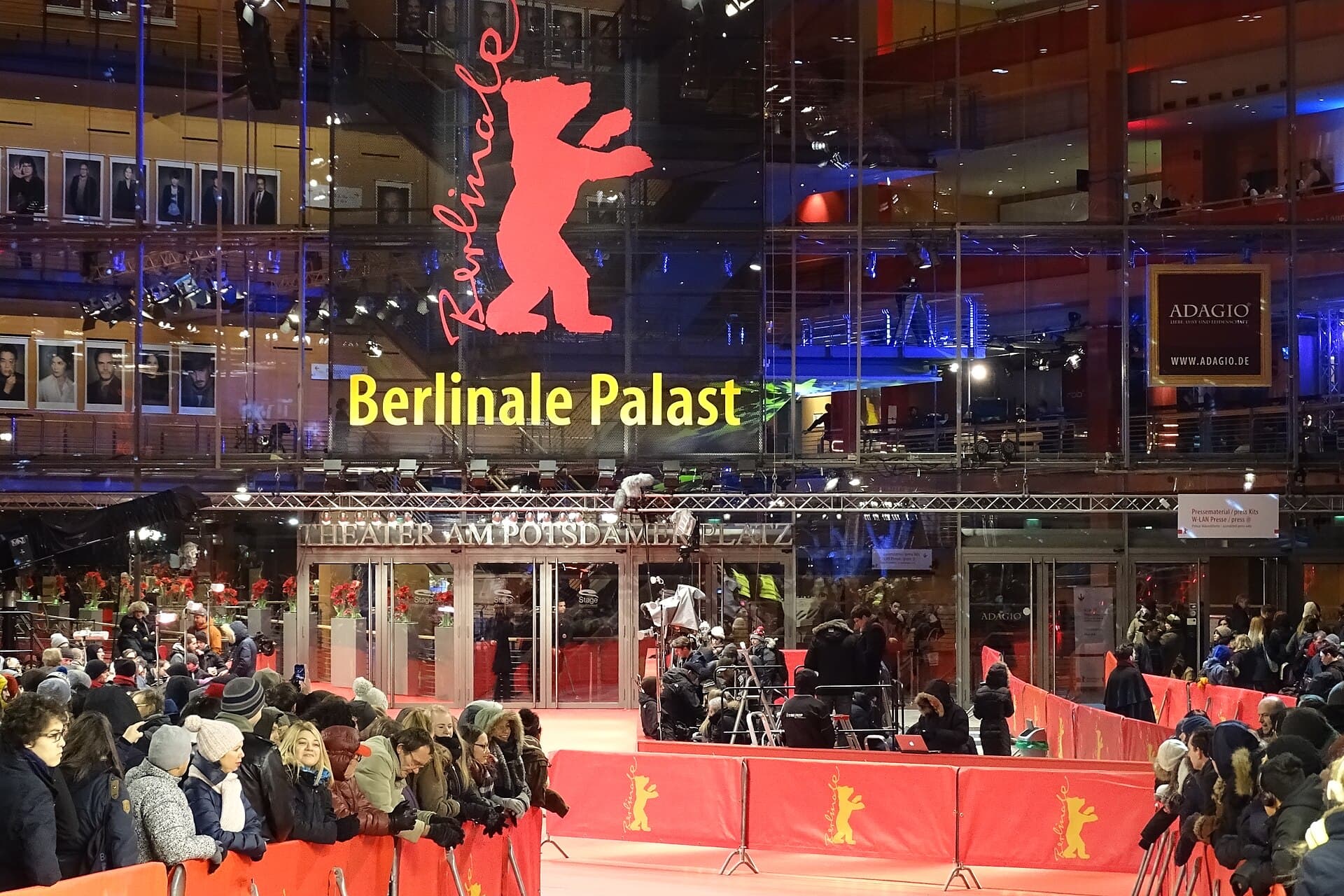 The Berlinale Palast on Marlene-Dietrich-Platz at Potsdamer Platz with the red carpet and bear banners at night