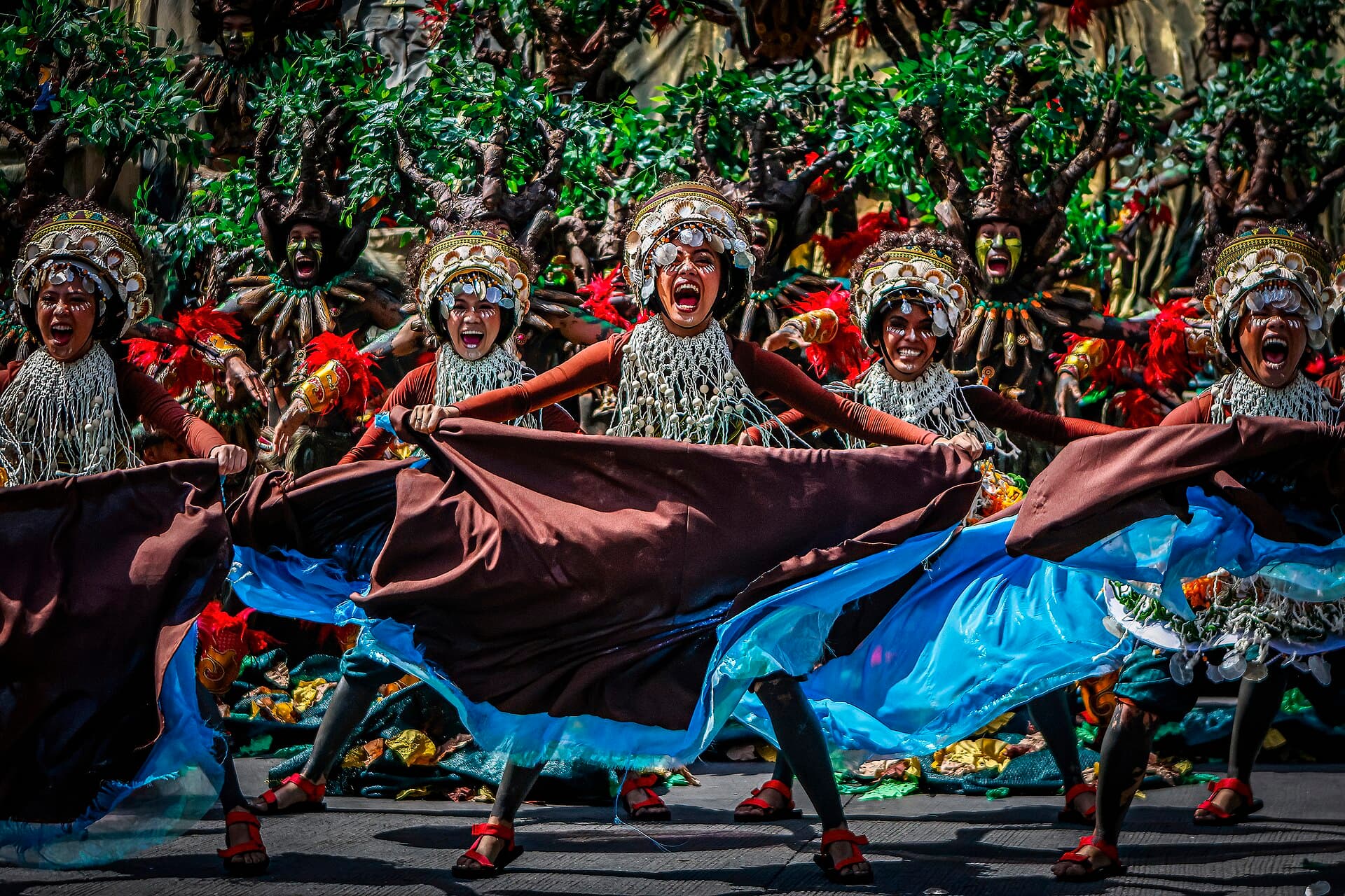 Dinagyang tribe drummers beating PVC Dinagyang pipes with rubber paddles during the tribes competition in Iloilo City