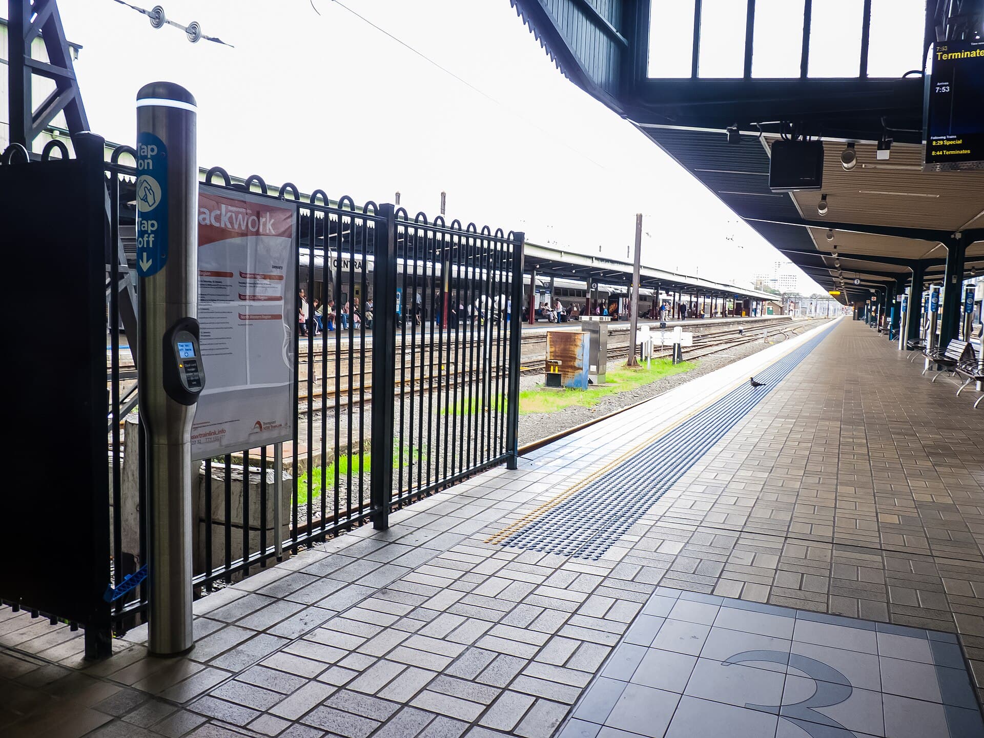 Tamworth railway station platform with a NSW TrainLink Xplorer train arriving
