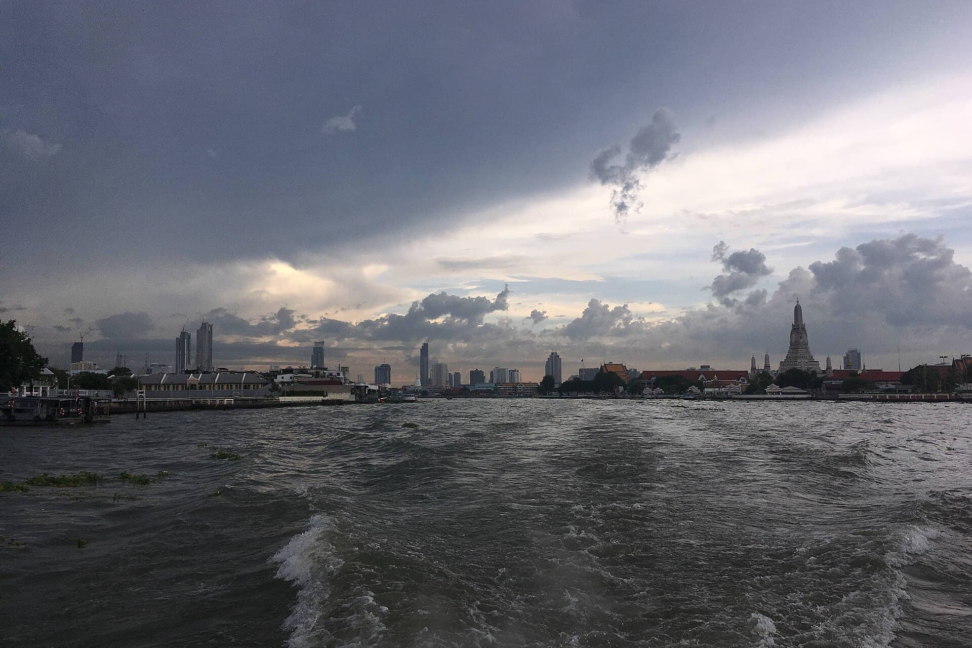Wat Arun seen from the Chao Phraya River with an express boat passing