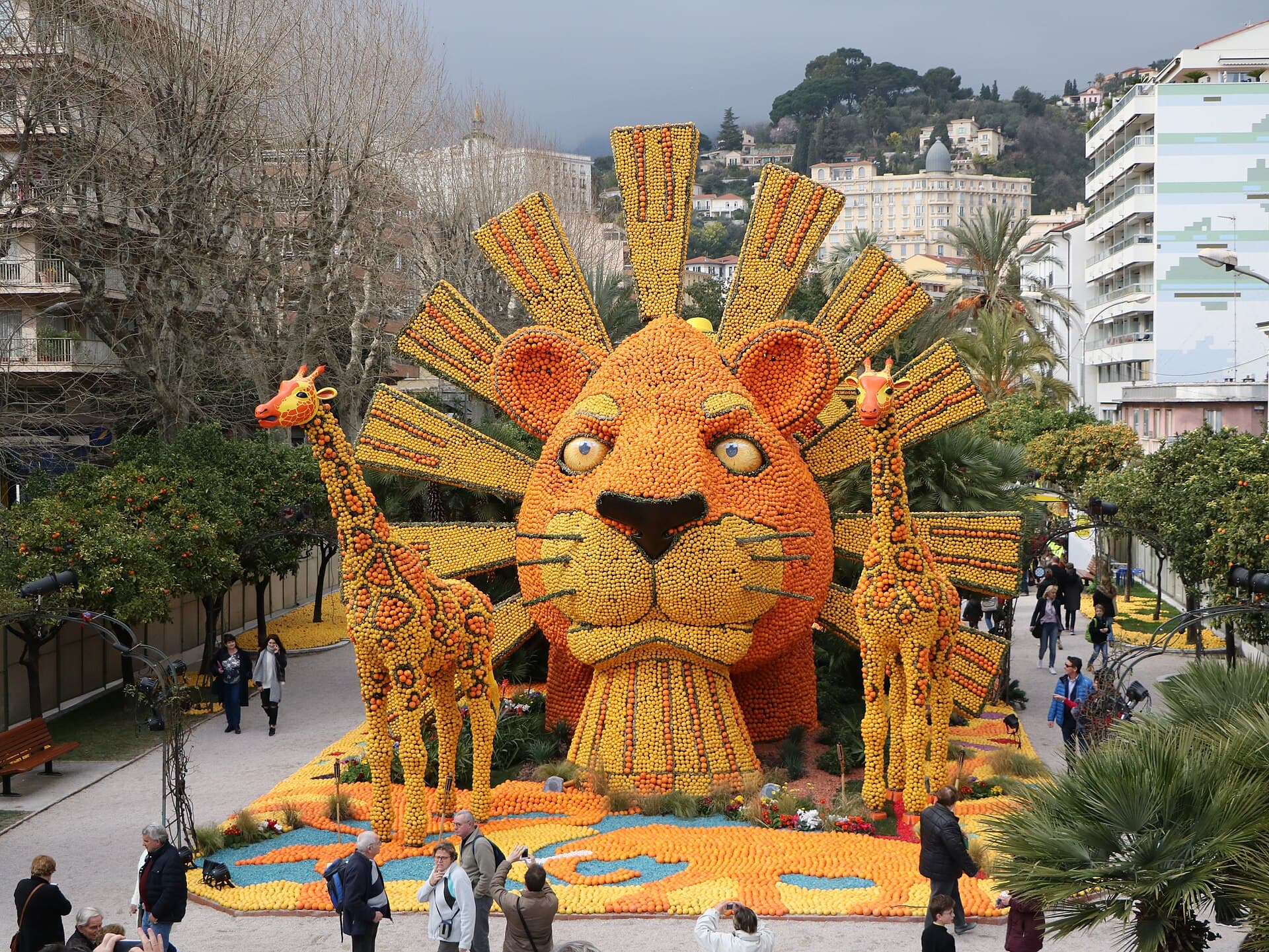 Float covered in lemons and oranges passing along the Promenade du Soleil in Menton during the Corso des fruits d'or