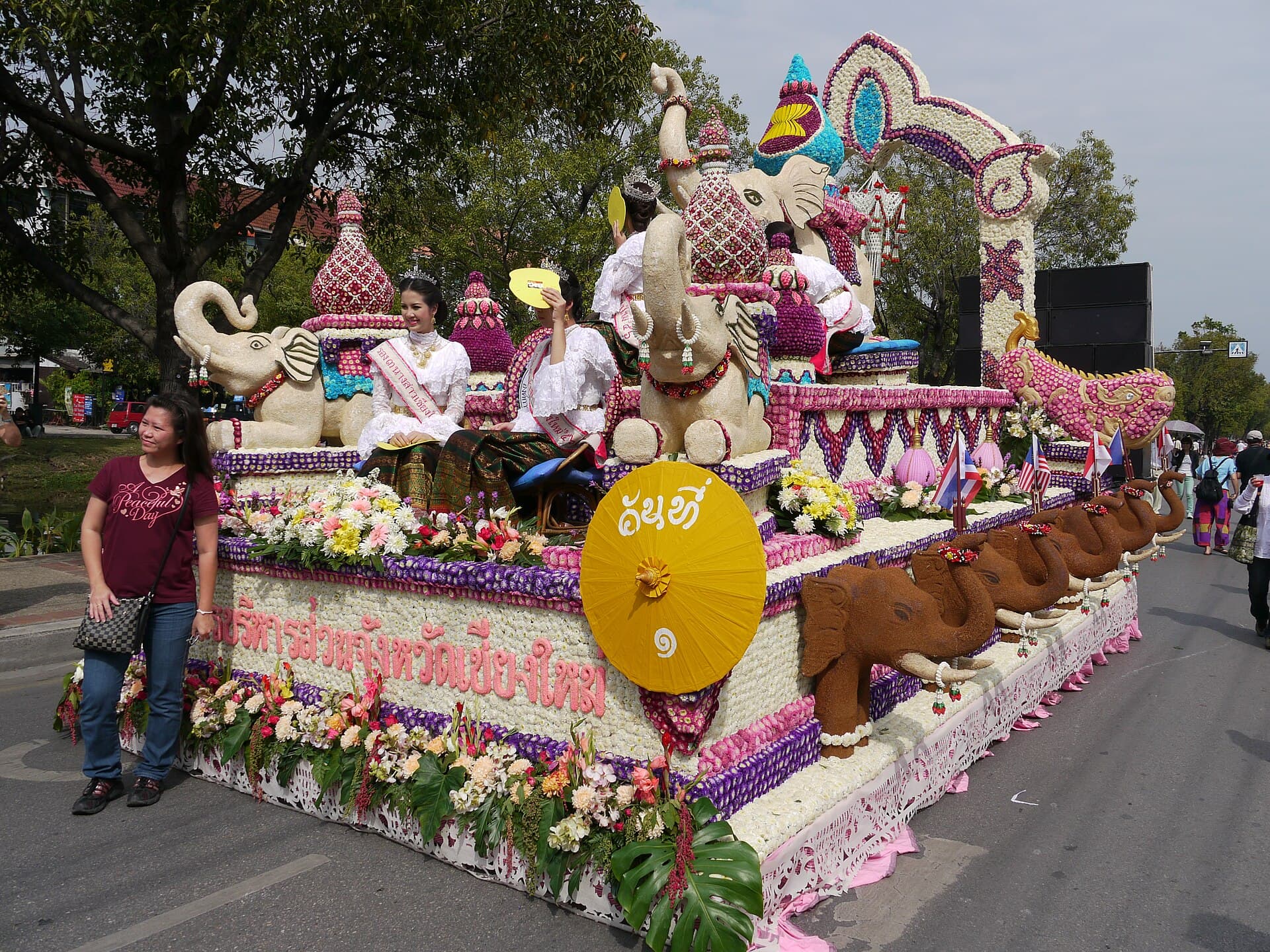 Floats lined along Thapae Road in Chiang Mai with spectators on both sides