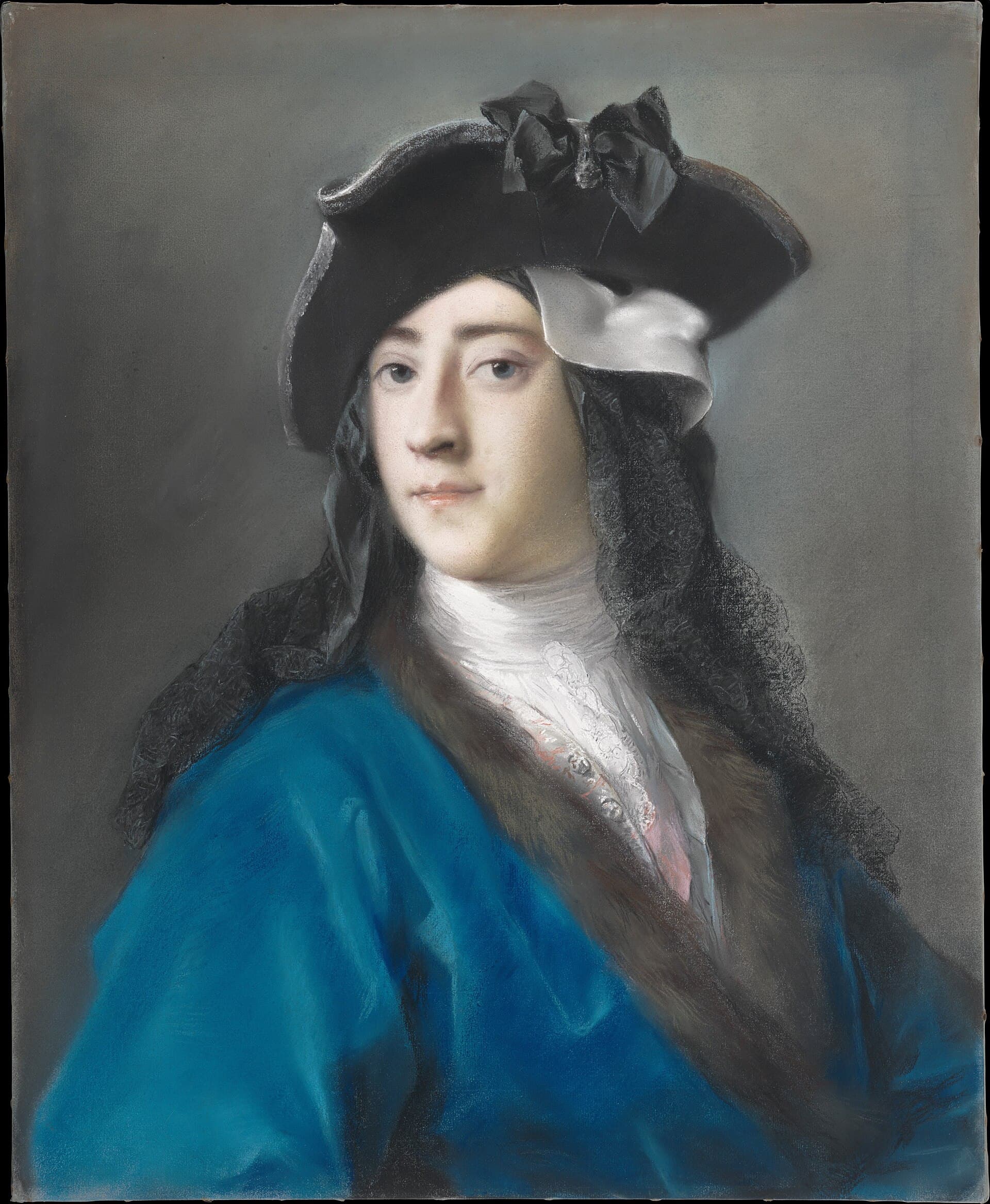 Masked couple in eighteenth-century costume posing on the Riva degli Schiavoni with San Giorgio Maggiore behind them