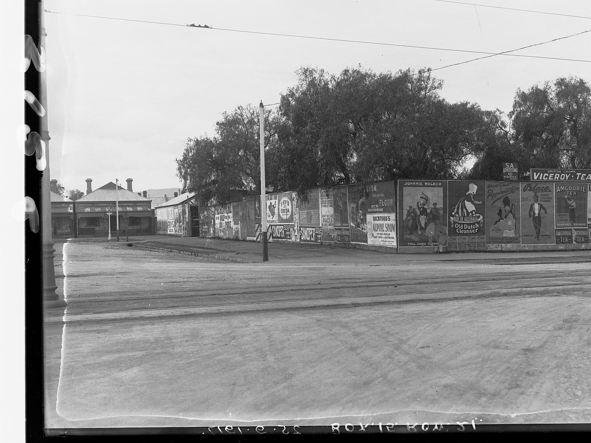 A Fringe poster wall and a box office line in Adelaide's East End