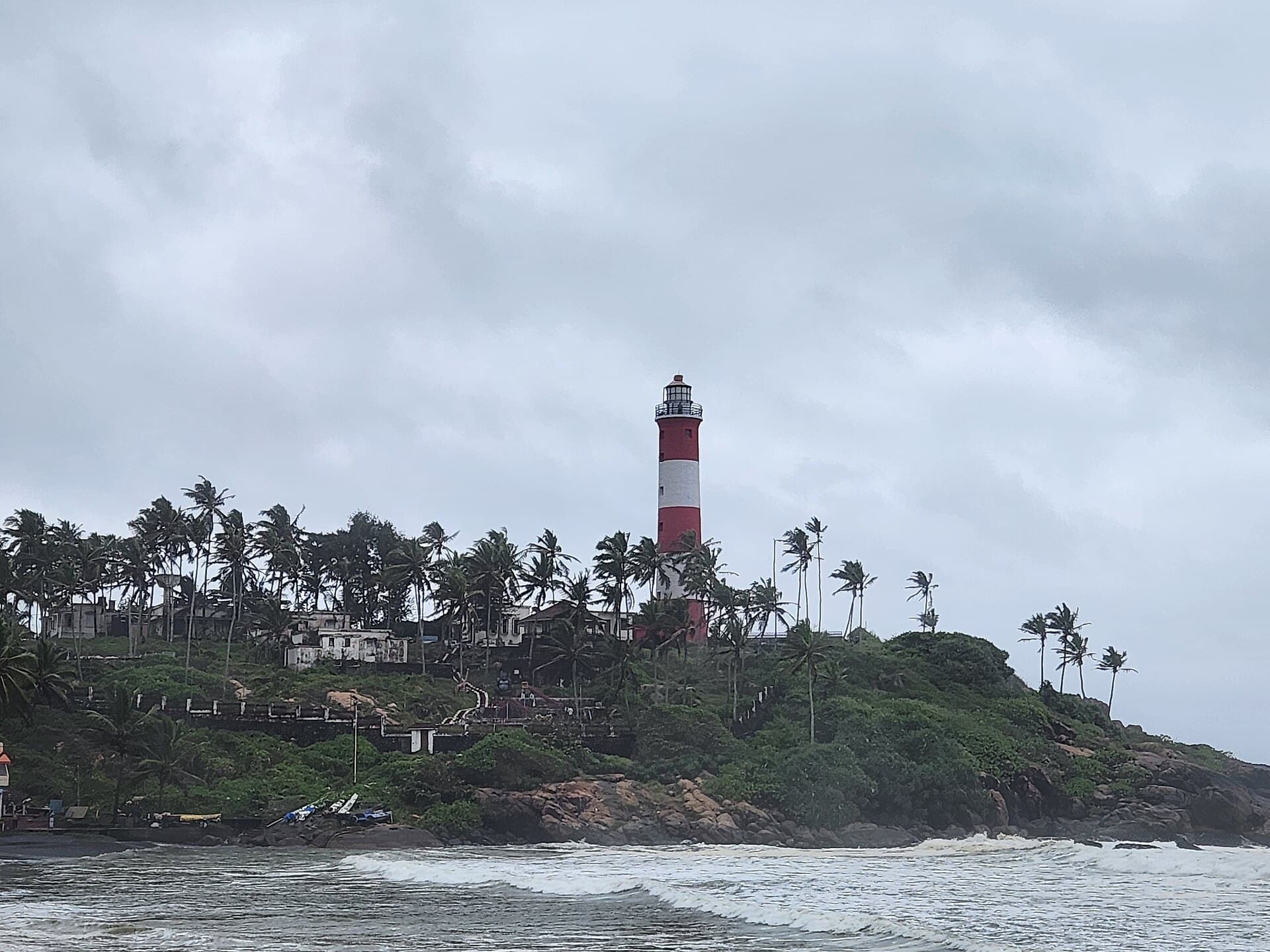 The Kovalam Lighthouse Beach with the lighthouse and the Arabian Sea in Kerala