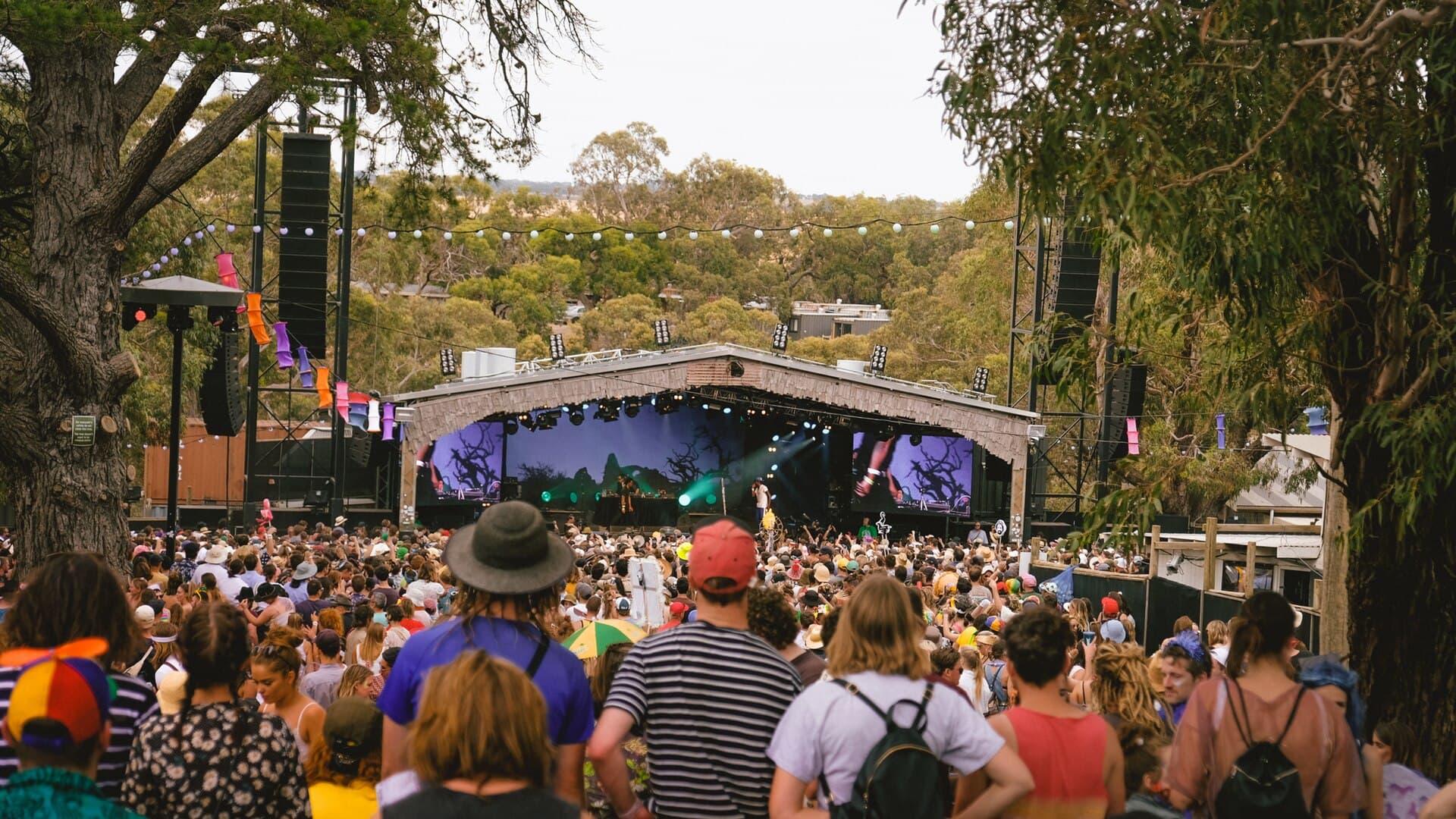 The Meredith Gift footrace with nude runners crossing the grass in front of the crowd in the Amphitheatre
