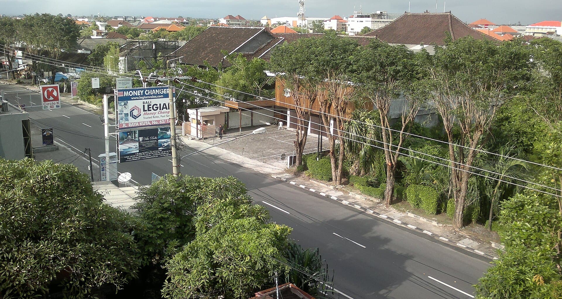 Empty Ngurah Rai airport terminal with closed check-in counters during Nyepi