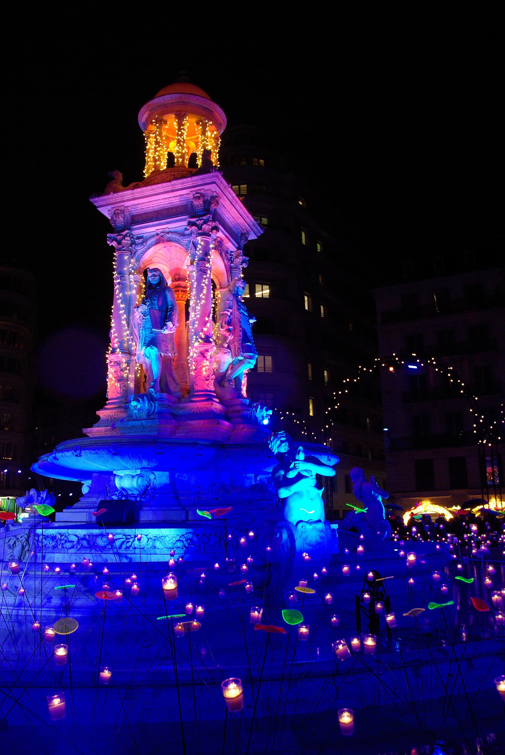 A stand selling lumignon candles in coloured glass on Place Bellecour in Lyon