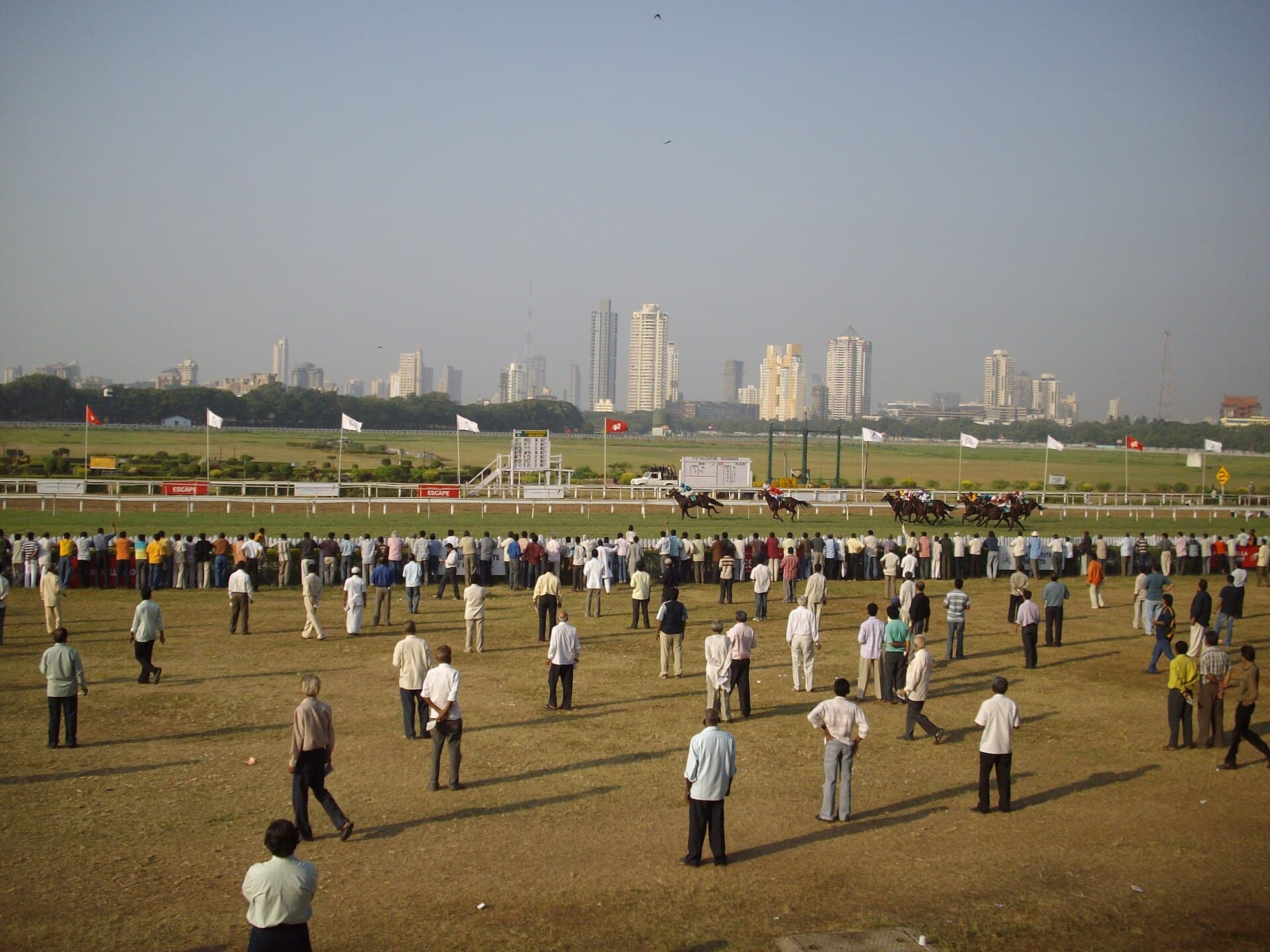 Wide shot of the Mahalaxmi Racecourse grandstand and track in Mumbai
