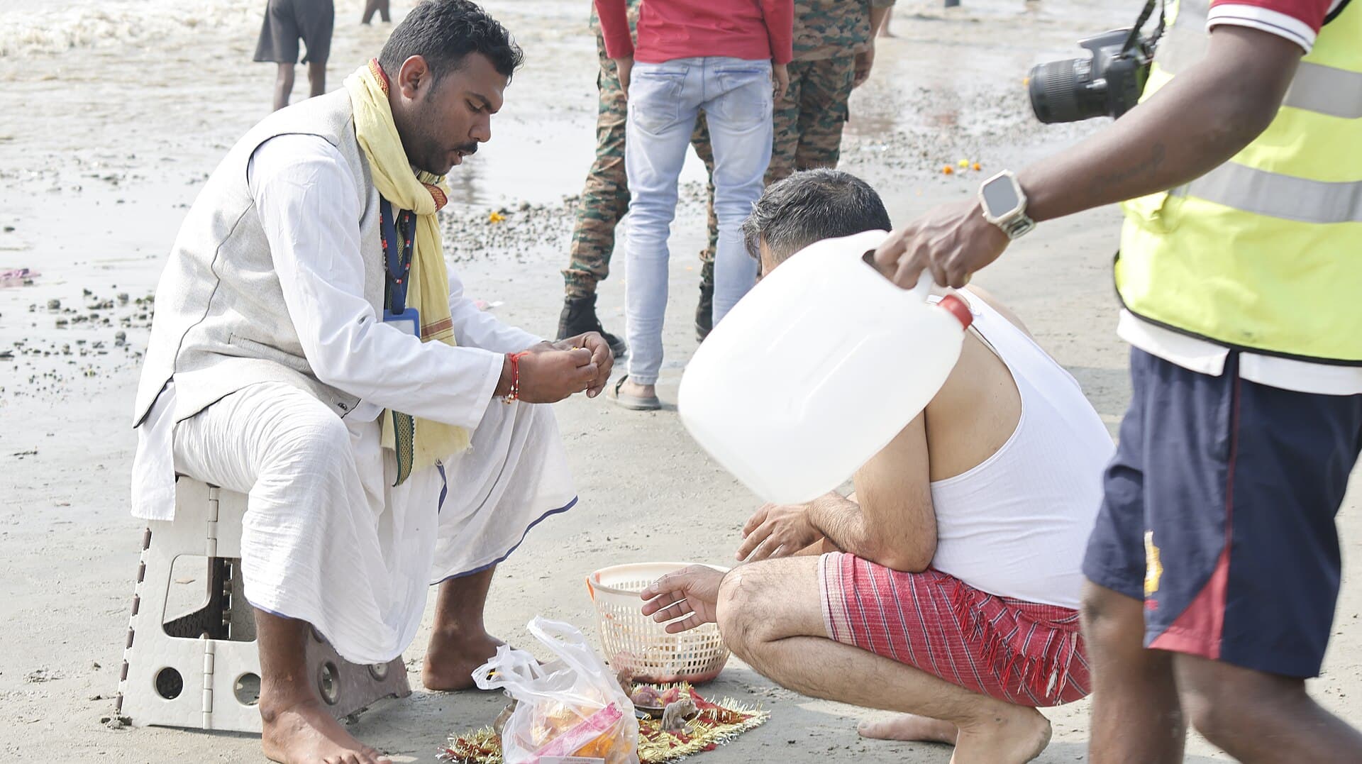 Pilgrims taking the holy dip at the confluence of the Ganges and the Bay of Bengal at Gangasagar, Sagar Island, on Makar Sankranti