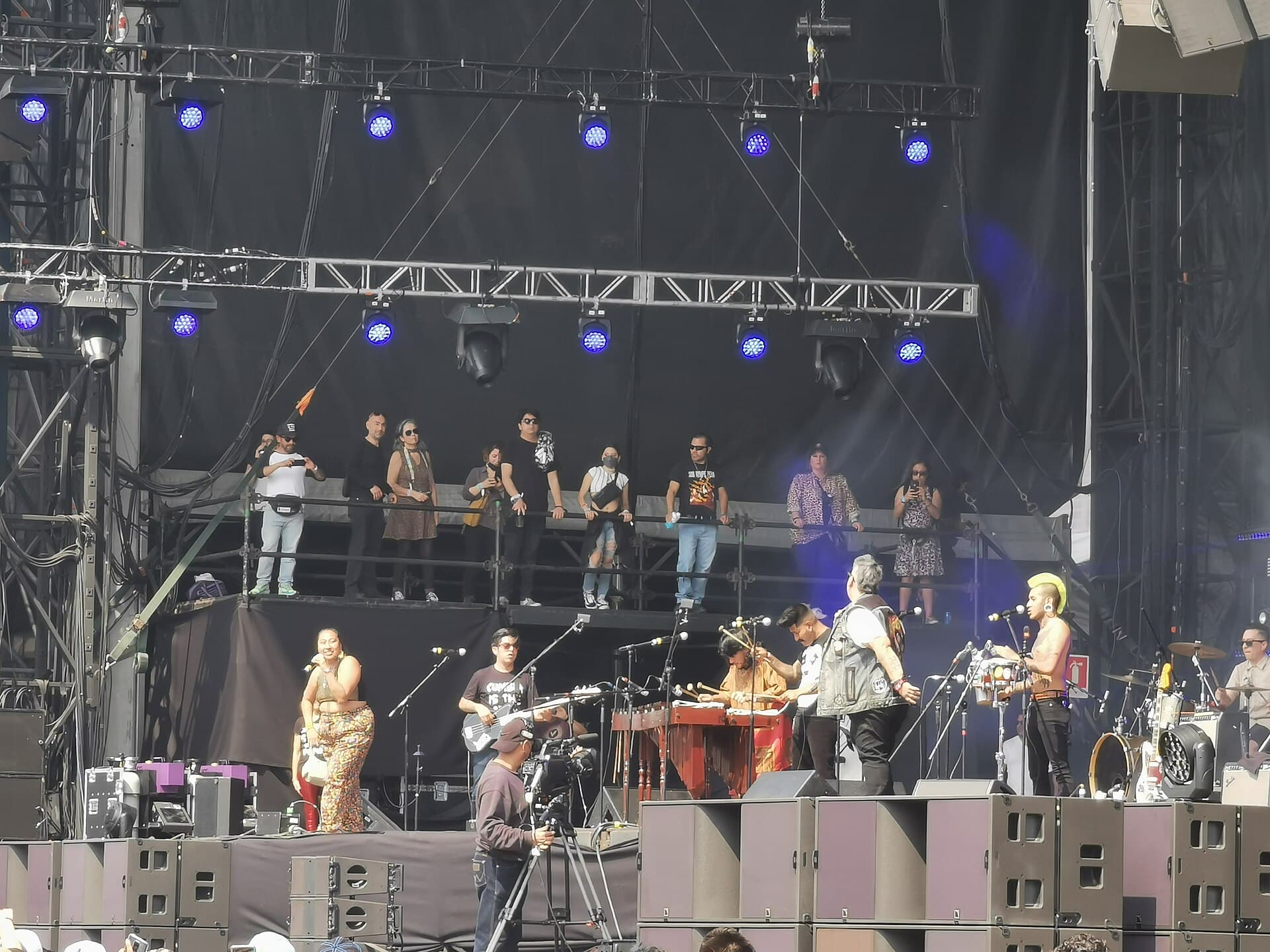 Close-up of a band on the Carpa Intolerante tent stage with the crowd dancing