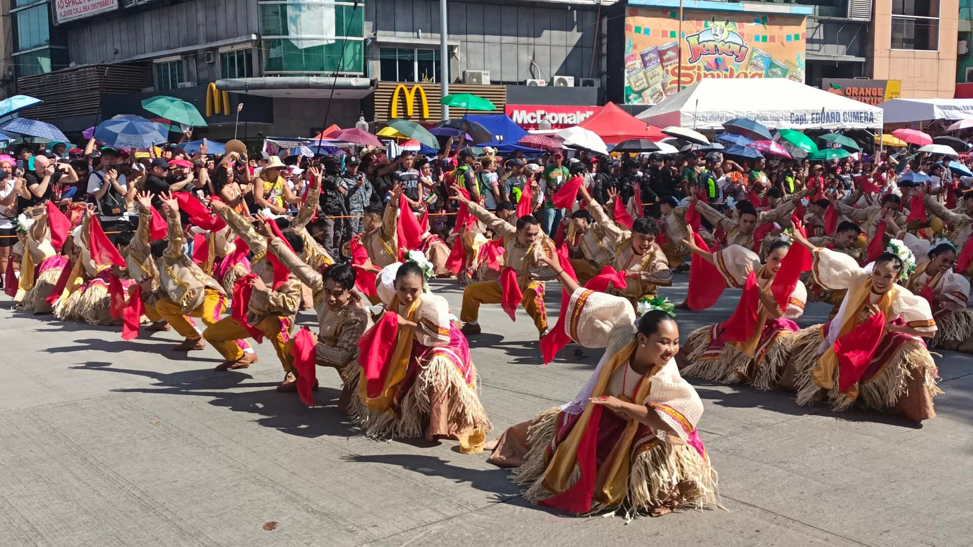 Candle vendors dancing the Sinulog prayer outside the Basilica del Santo Niño in Cebu City