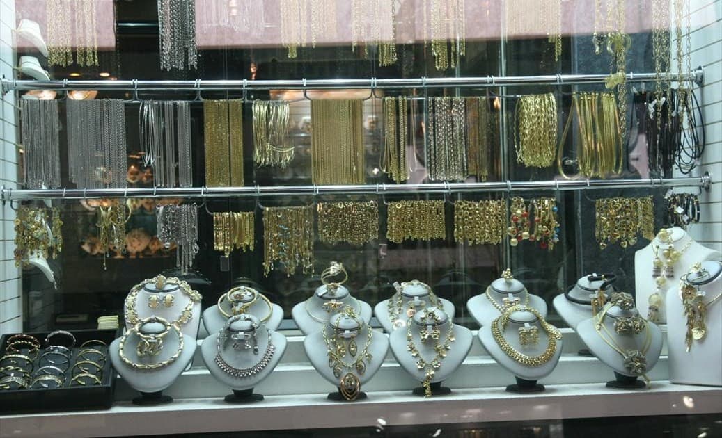 Gold Souk in Deira, Dubai, with shop windows in the evening