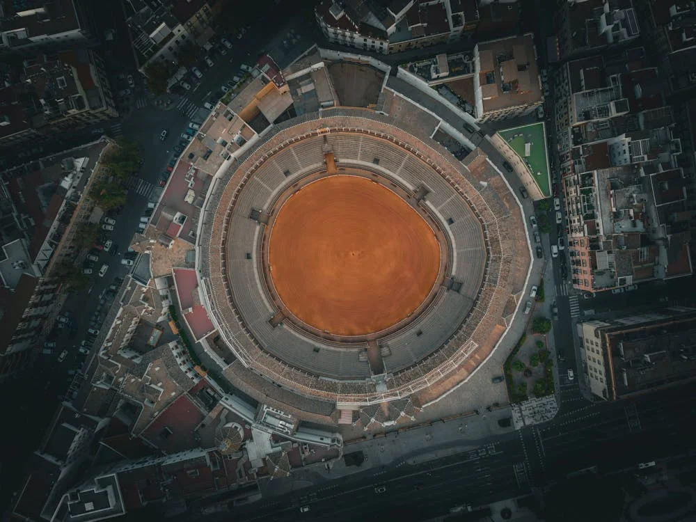 the iconic bullring in Seville, Andalusia, Spain, surrounded by historic architecture and cityscape