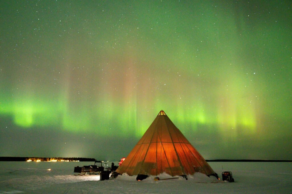 Guided Northern Lights tour in Iceland with expert explaining aurora activity, popular option for how to chase the Northern Lights in Iceland