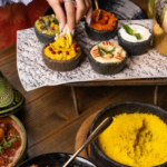Authentic Moroccan food spread featuring tagine among the best local foods to try in Morocco